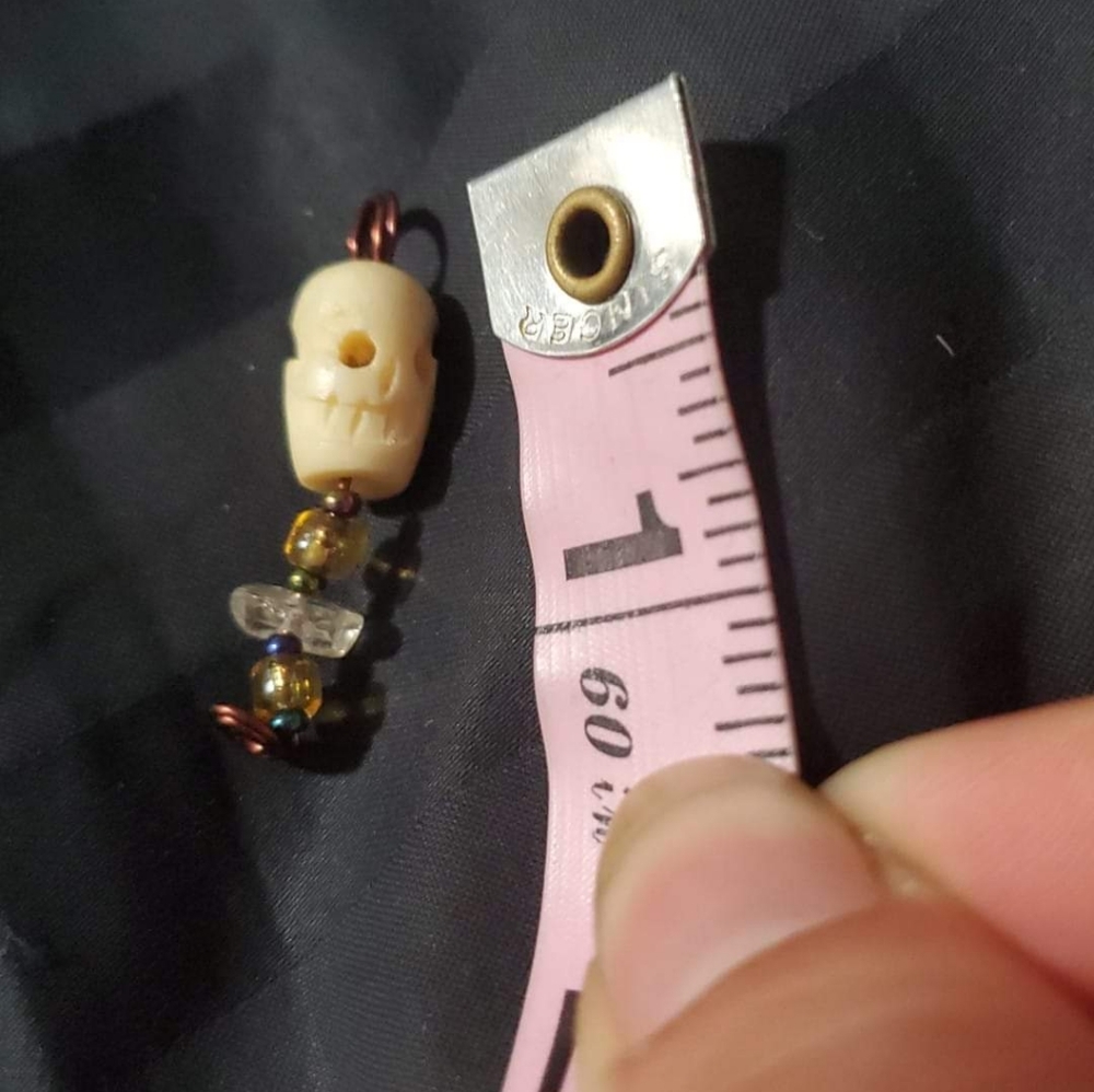 Bone skull charm